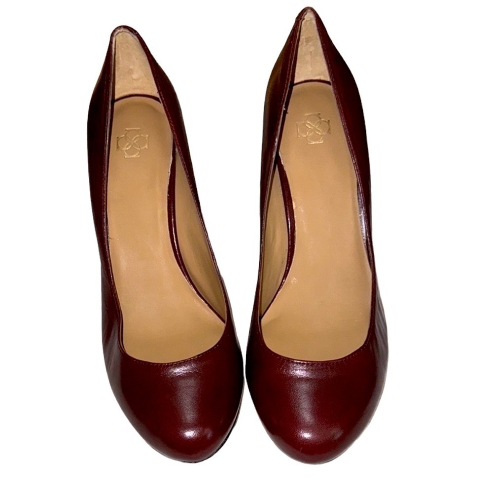 Ann Taylor leather pumps, size 7 1/2 burgundy with metal logo on leather bottom